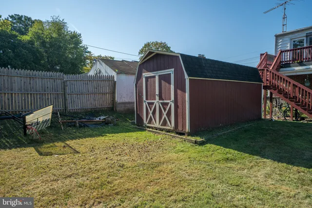 a view of a backyard with furniture