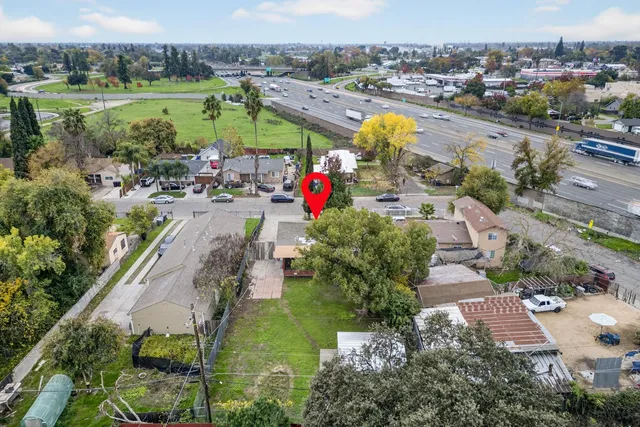 an aerial view of residential houses with outdoor space