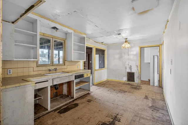 a bathroom with a toilet sink and a mirror