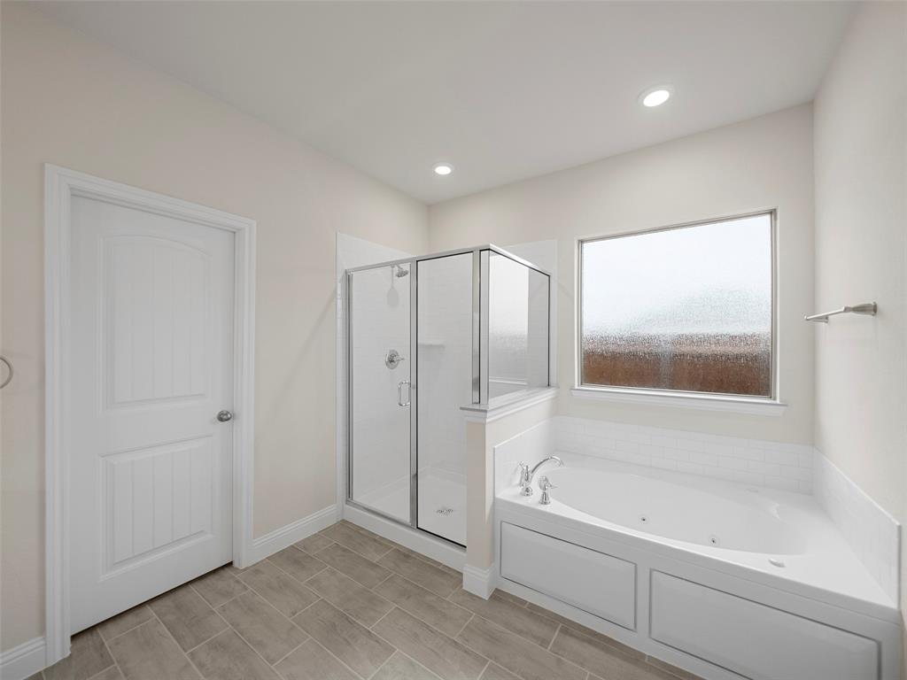 1505 Pegasus Drive Lancaster, TX 75134 - Photo 6 of 10 a bathroom with a bathtub and a shower
