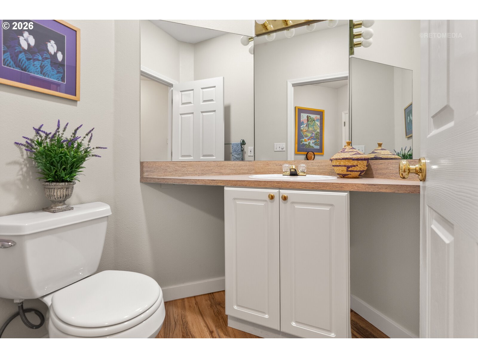 8325 Southwest Seneca Street Tualatin, OR 97062 - Photo 14 of 39 a bathroom with a toilet a sink and a mirror