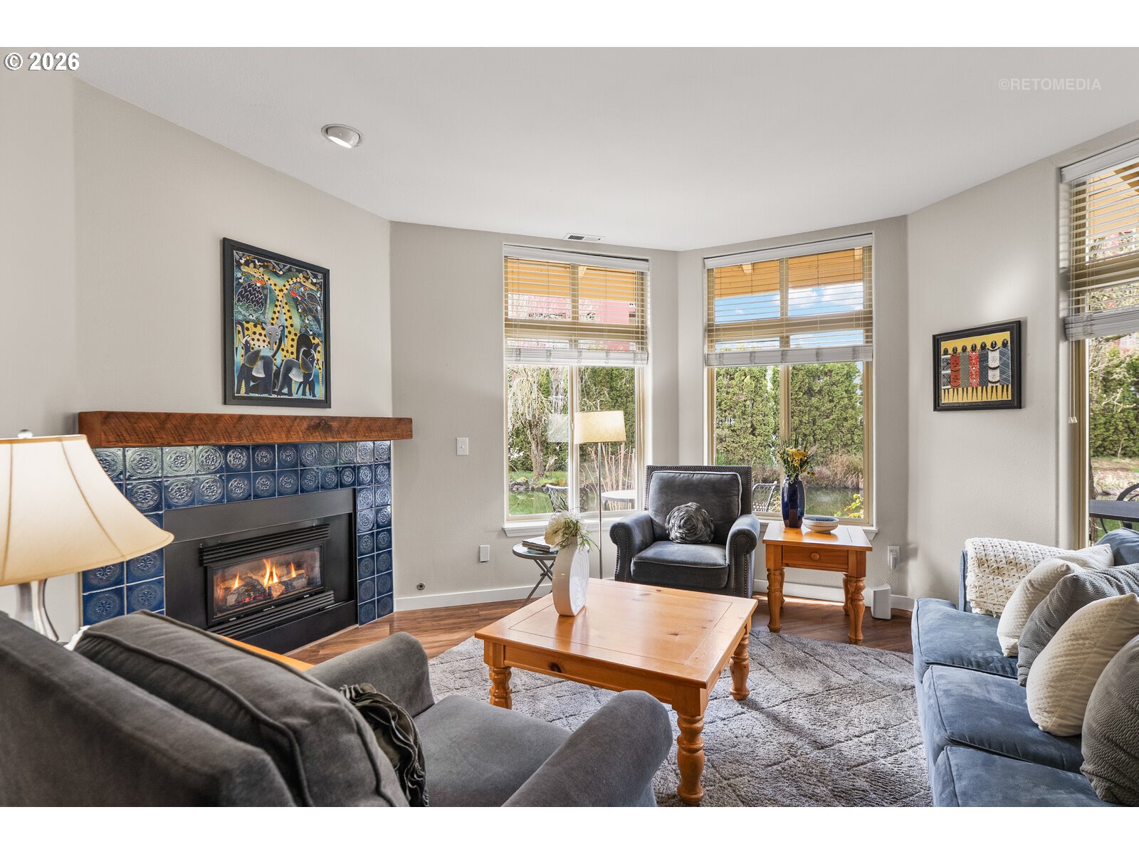8325 Southwest Seneca Street Tualatin, OR 97062 - Photo 3 of 39 a living room with furniture and a fireplace