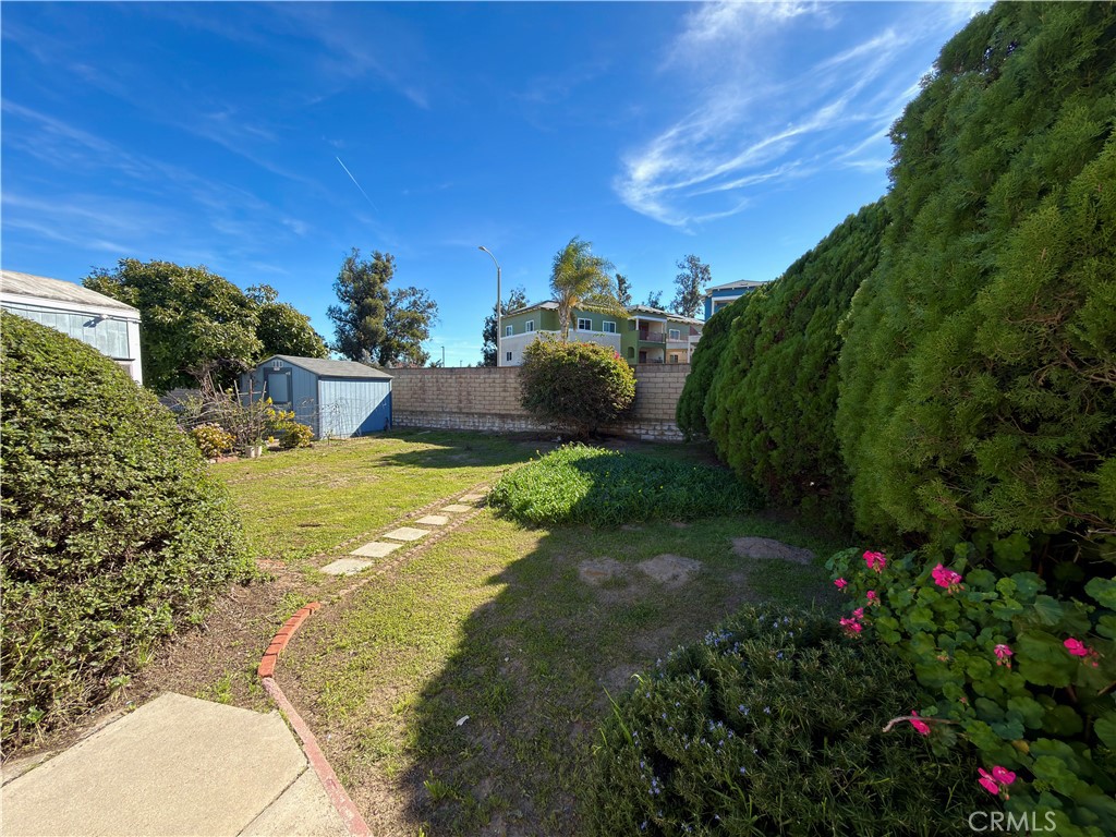 2140 Robin Avenue, Unit 2140A Oxnard, CA 93033 - Photo 12 of 17 a view of a patio with table and chairs and potted plants