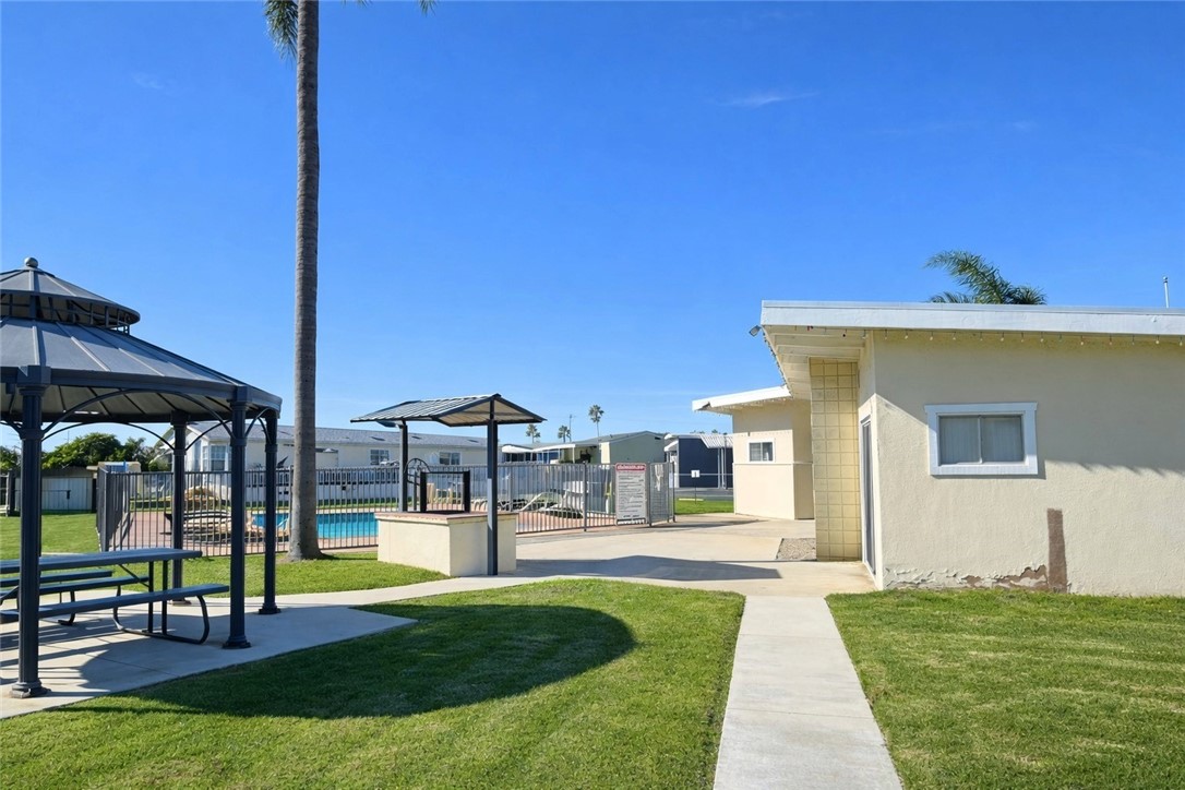 2140 Robin Avenue, Unit 2140A Oxnard, CA 93033 - Photo 15 of 17 a view of a house with swimming pool