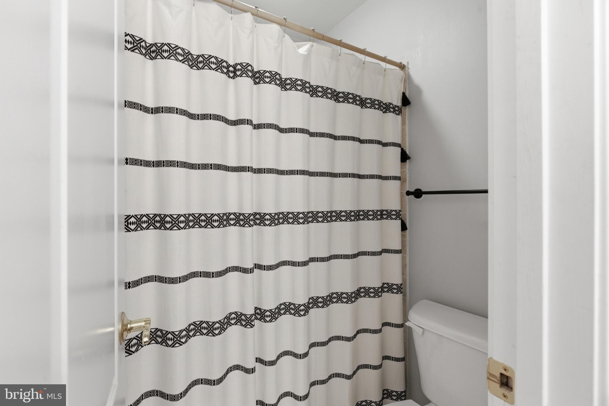 1219 Meadow View Road Pasadena, MD 21122 - Photo 42 of 70 Chic bathroom retreat with modern flair.