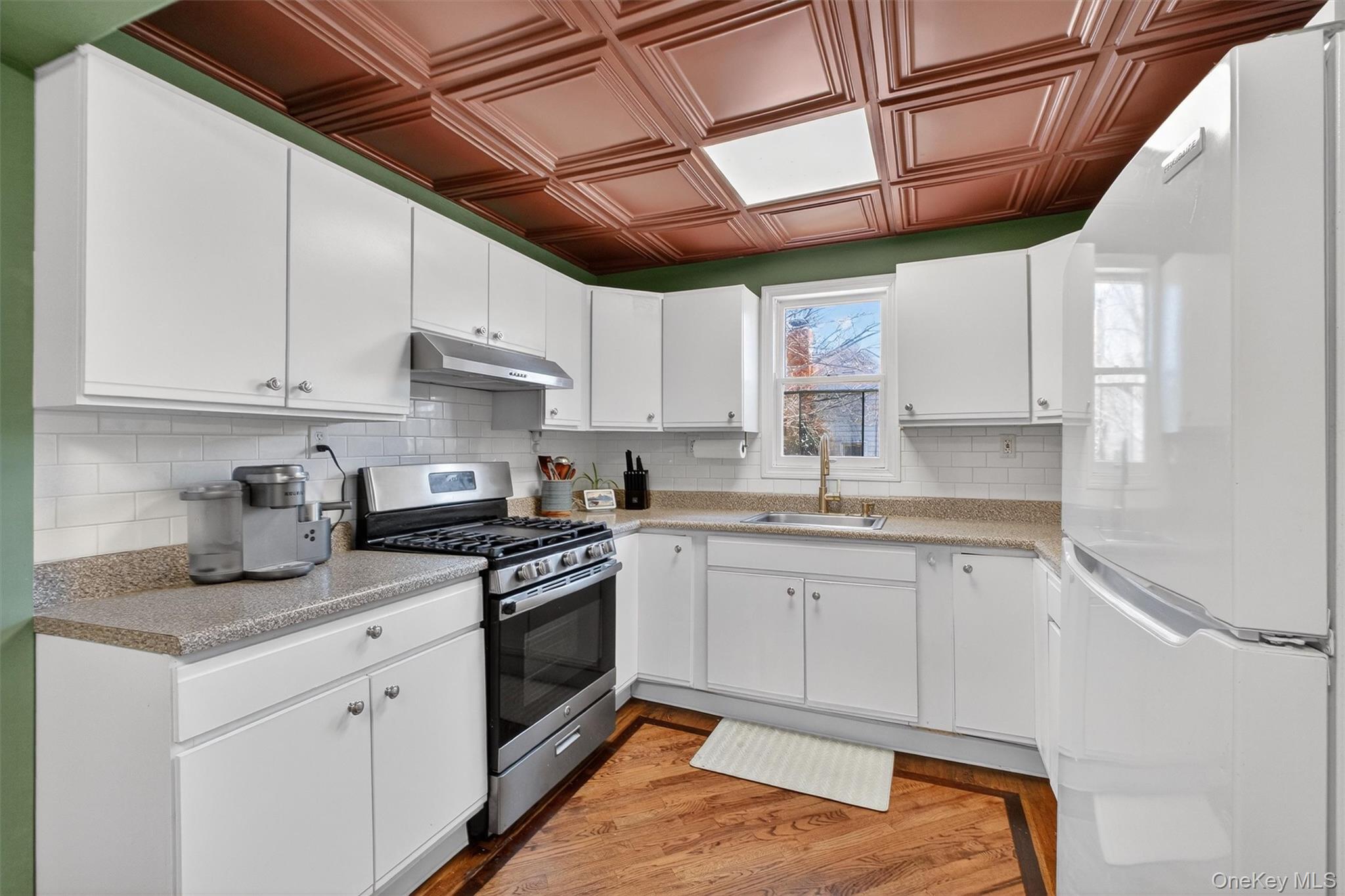 175 Terry Hill Road Carmel, NY 10512 - Photo 11 of 33 a kitchen with stainless steel appliances granite countertop a sink window and cabinets