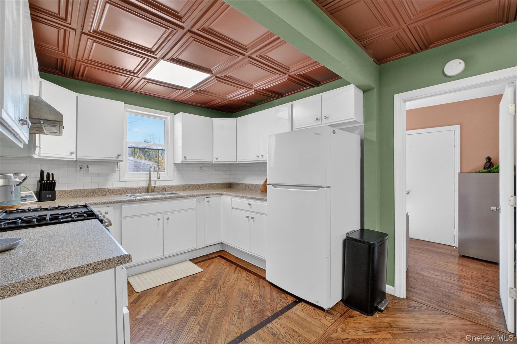 175 Terry Hill Road Carmel, NY 10512 - Photo 13 of 33 a kitchen with cabinets and wooden floor