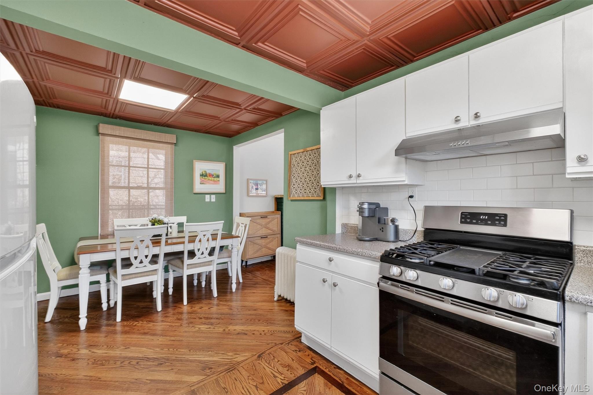 175 Terry Hill Road Carmel, NY 10512 - Photo 10 of 33 a kitchen with stainless steel appliances a stove a table chairs and a refrigerator