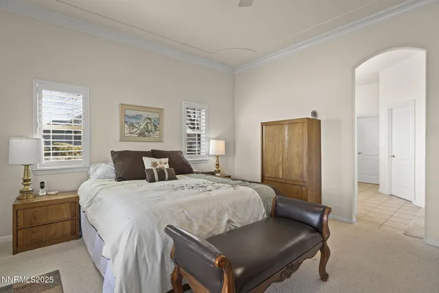 a bed room with a bed and a window