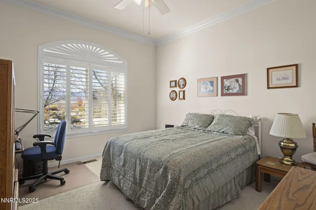 a bedroom with a bed and a desk