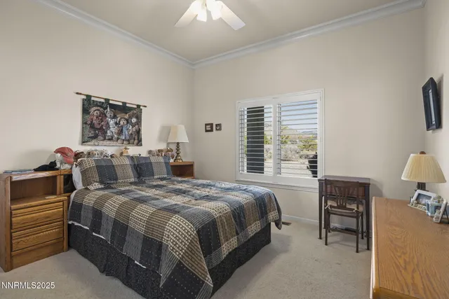 a bedroom with a bed and a table in it