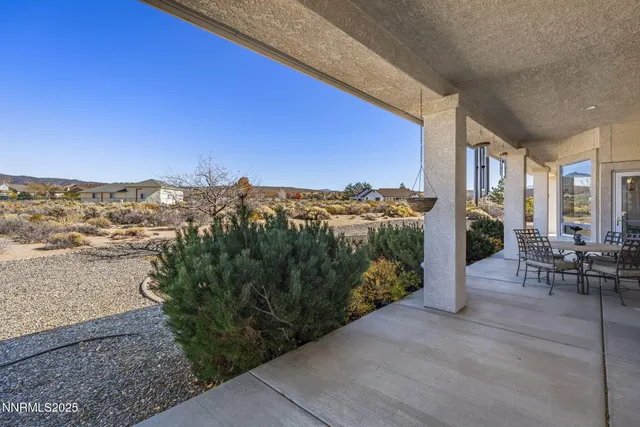 a view of a terrace with sitting area