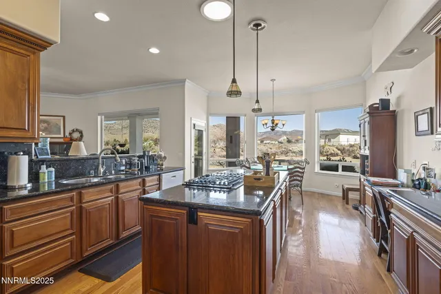 a kitchen with lots of counter space dining table and chairs