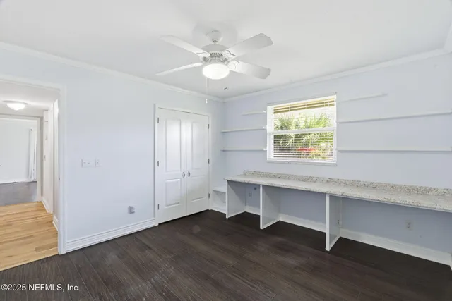 a view of a patio with a table chairs and a backyard
