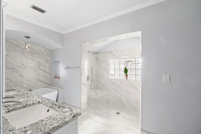 a front view of a house with outdoor seating