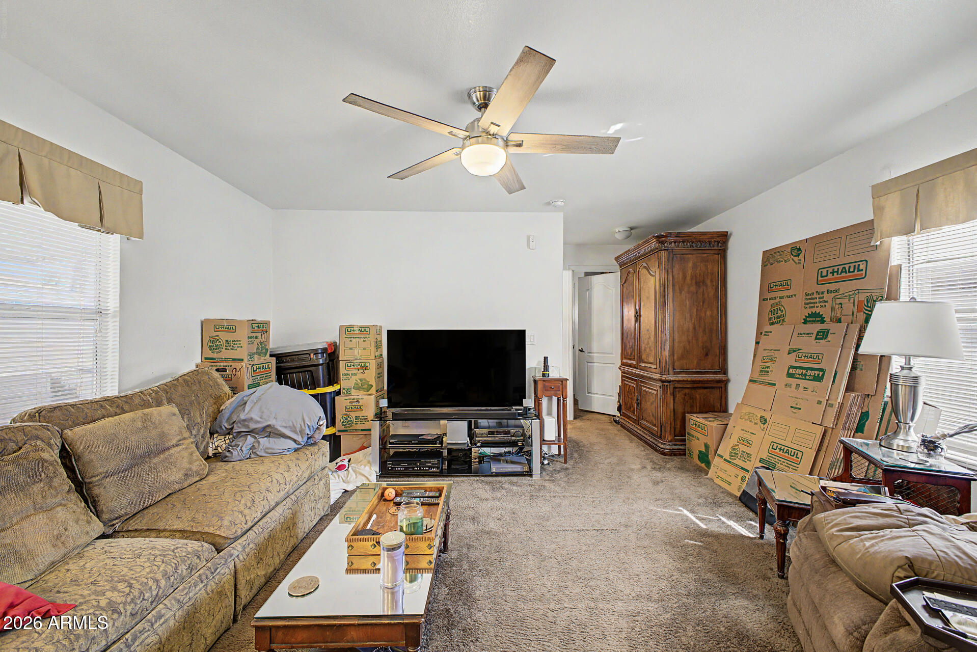 625 West McKellips Road, Unit 55 Mesa, AZ 85201 - Photo 8 of 21 a living room with furniture and a flat screen tv