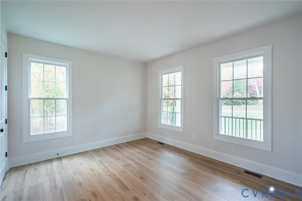 a spacious bathroom with a bathtub shower sink and toilet