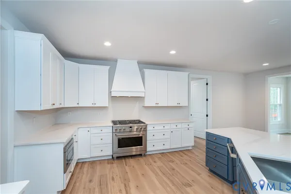 a kitchen with stainless steel appliances sink refrigerator and stove
