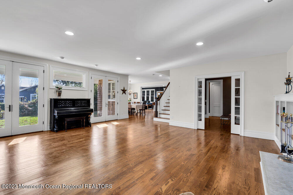405 Brown Street Brielle, NJ 08730 - Photo 12 of 92 a living room with fireplace furniture and a wooden floor