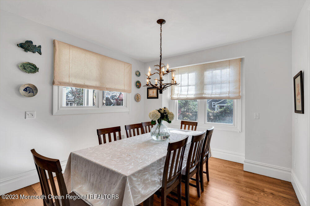 405 Brown Street Brielle, NJ 08730 - Photo 17 of 92 a view of a dining room with furniture window and wooden floor