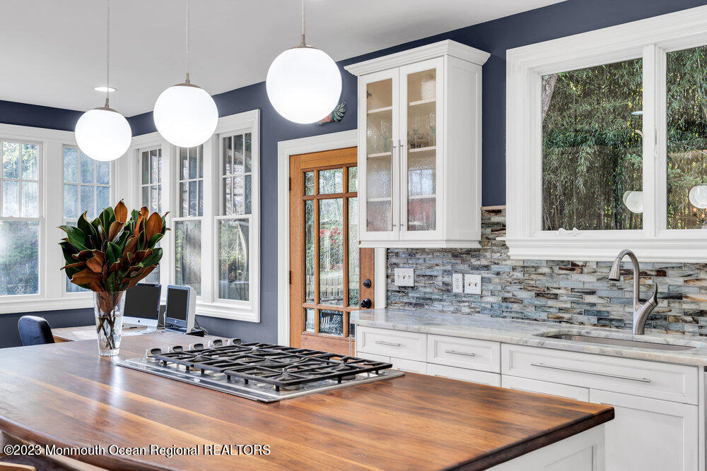 405 Brown Street Brielle, NJ 08730 - Photo 23 of 92 a view of a kitchen with granite countertop a sink stainless steel appliances and cabinets