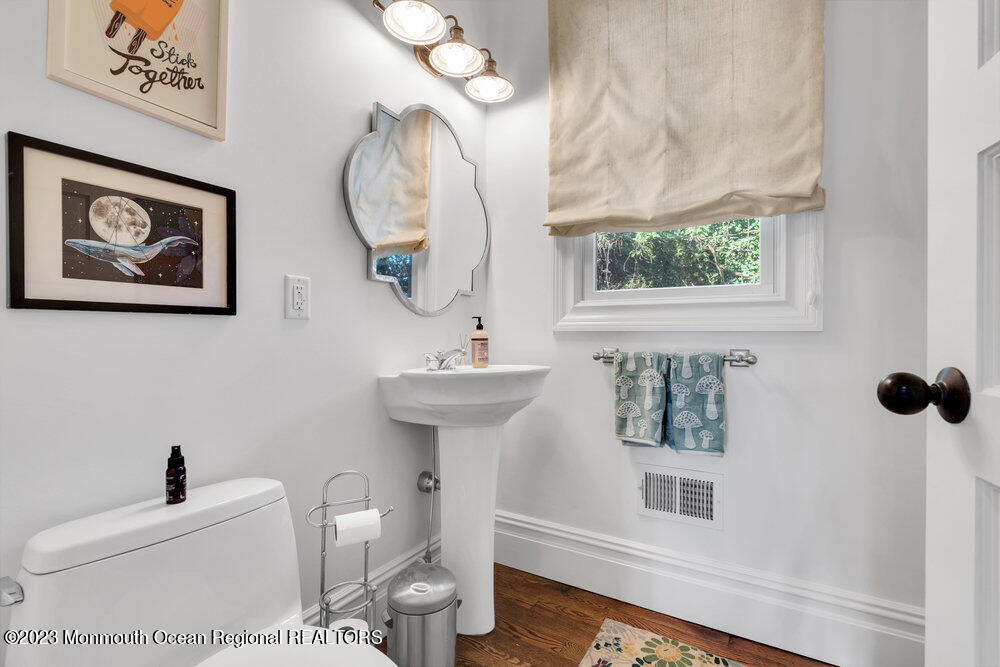 405 Brown Street Brielle, NJ 08730 - Photo 30 of 92 a bathroom with a toilet a sink and a mirror