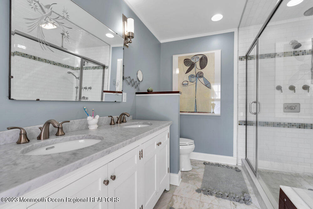 405 Brown Street Brielle, NJ 08730 - Photo 41 of 92 a bathroom with a granite countertop sink mirror vanity and toilet