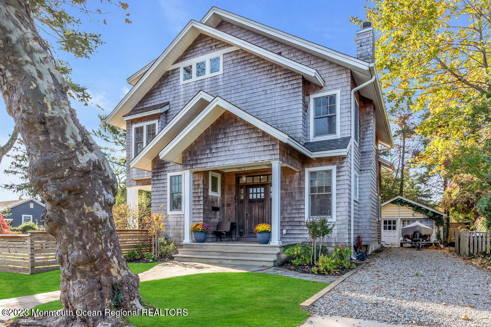 405 Brown Street Brielle, NJ 08730 - Photo 5 of 92 a front view of a house with garden