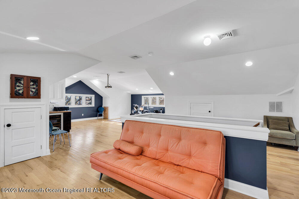 405 Brown Street Brielle, NJ 08730 - Photo 57 of 92 a living room with furniture and a kitchen view