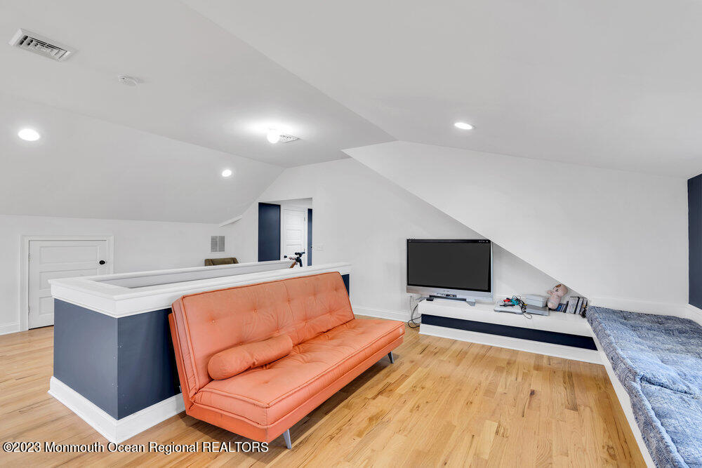 405 Brown Street Brielle, NJ 08730 - Photo 58 of 92 a living room with a flat screen tv and a couch