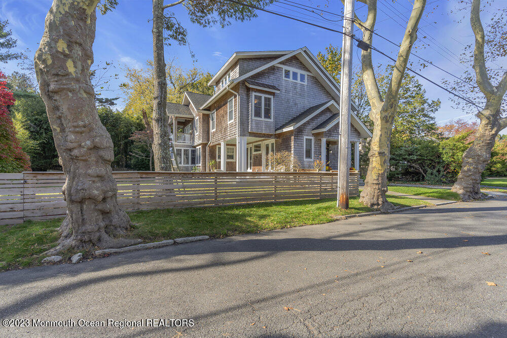 405 Brown Street Brielle, NJ 08730 - Photo 6 of 92 a front view of a house with a yard and trees