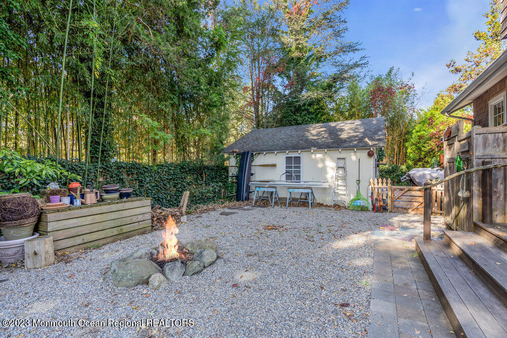 405 Brown Street Brielle, NJ 08730 - Photo 66 of 92 a view of a house with backyard and sitting area