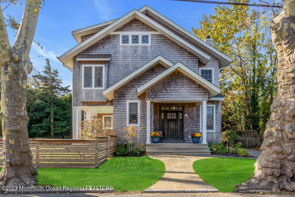 405 Brown Street Brielle, NJ 08730 - Photo 7 of 92 a front view of a house with a yard