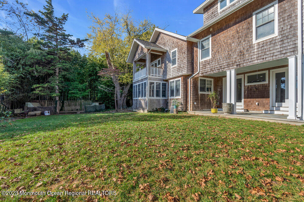 405 Brown Street Brielle, NJ 08730 - Photo 71 of 92 front view of a brick house with a yard