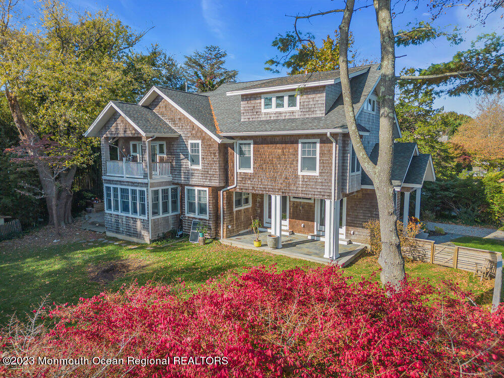 405 Brown Street Brielle, NJ 08730 - Photo 73 of 92 a front view of a house with garden