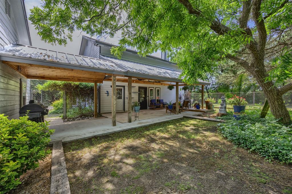 881 Wild Road Van Alstyne, TX 75495 - Photo 29 of 40 a view of a house with backyard sitting area and garden