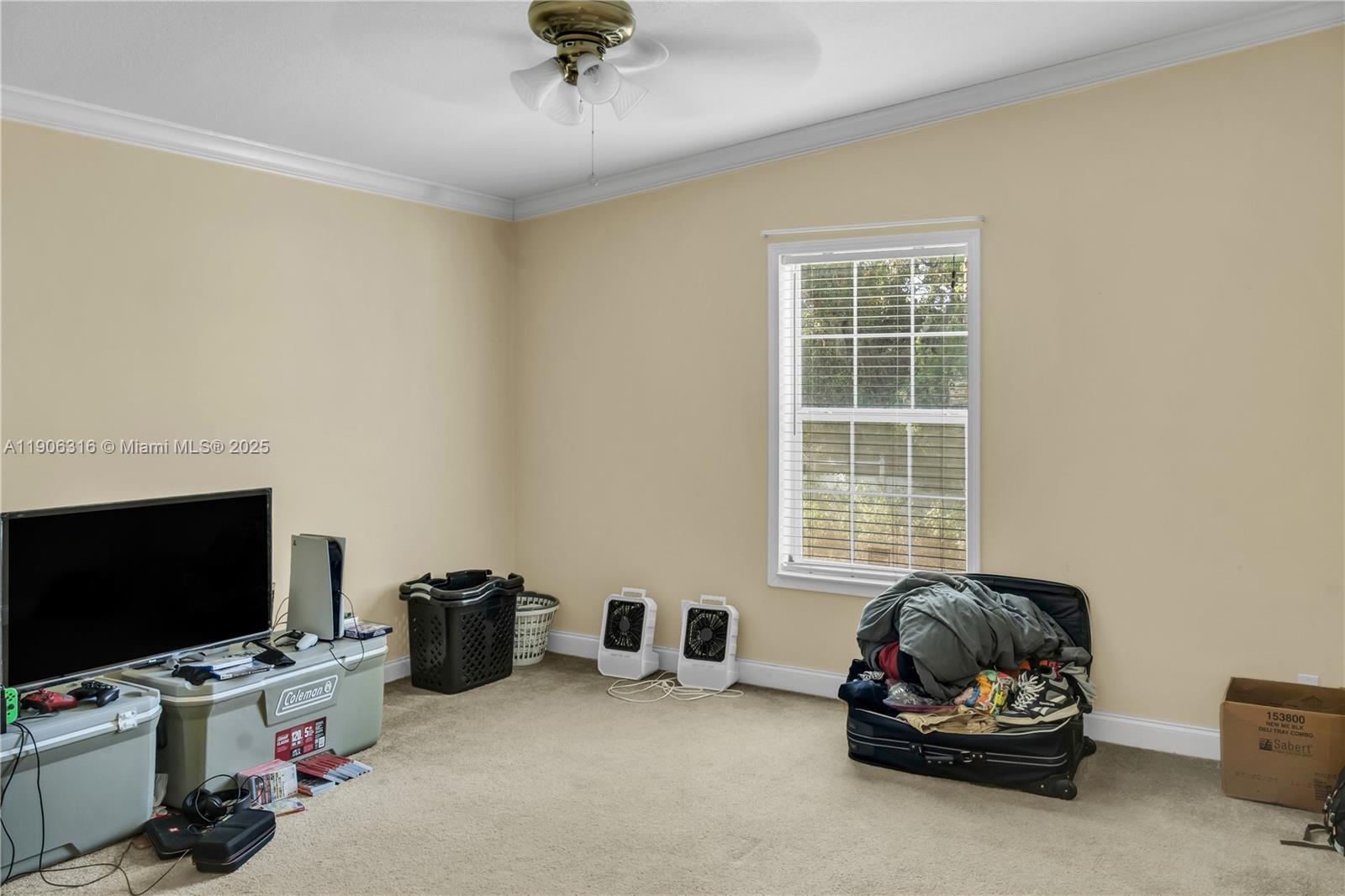 11341 Pruett Road Seffner, FL 33584 - Photo 18 of 50 a view of a livingroom with a window and a flat screen tv
