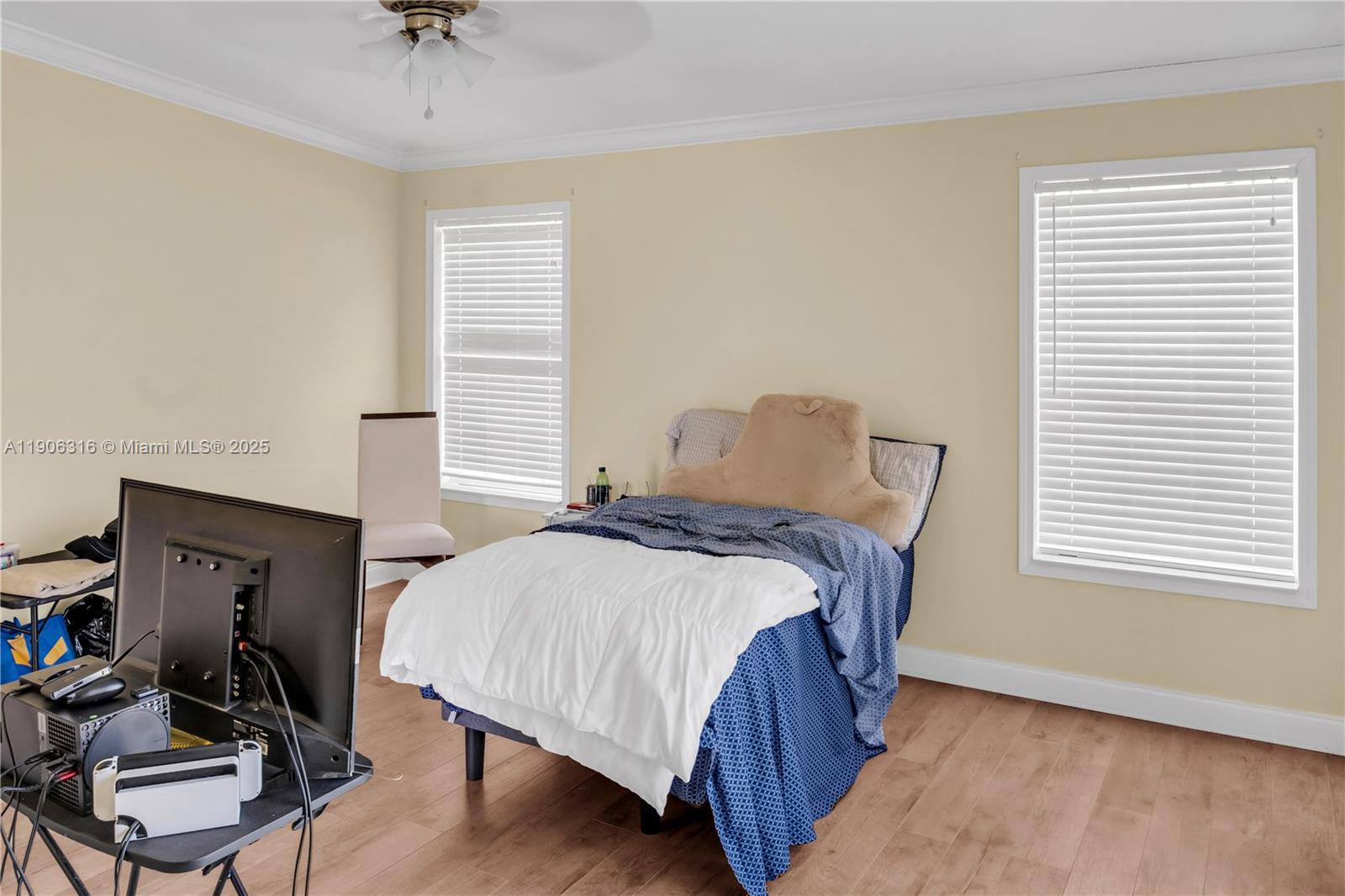 11341 Pruett Road Seffner, FL 33584 - Photo 24 of 50 a bedroom with a bed a dresser and chair