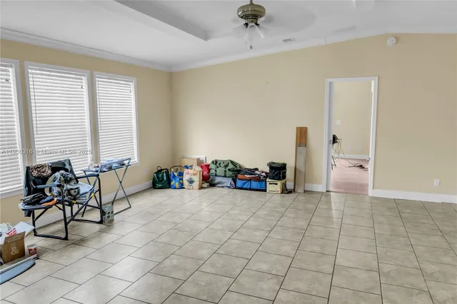a view of a room with window and lounge chairs