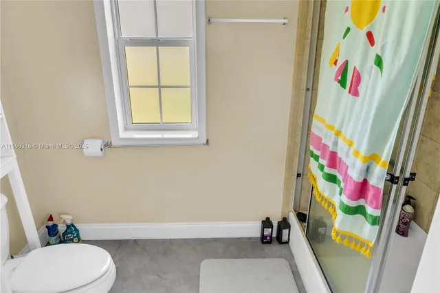 a bathroom with a sink toilet and bathtub