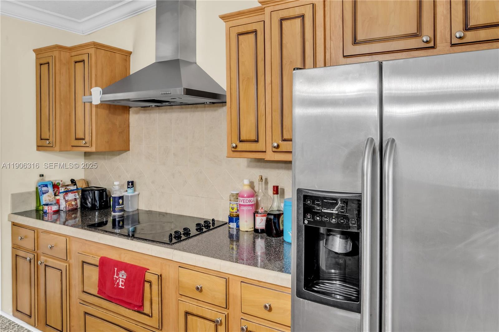 11341 Pruett Road Seffner, FL 33584 - Photo 36 of 50 a kitchen with stainless steel appliances granite countertop a refrigerator and a stove top oven