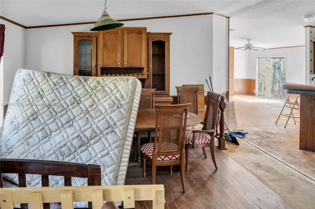 a bedroom with furniture and a wooden floor