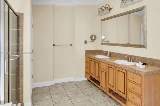 a bathroom with a double vanity sink and a mirror