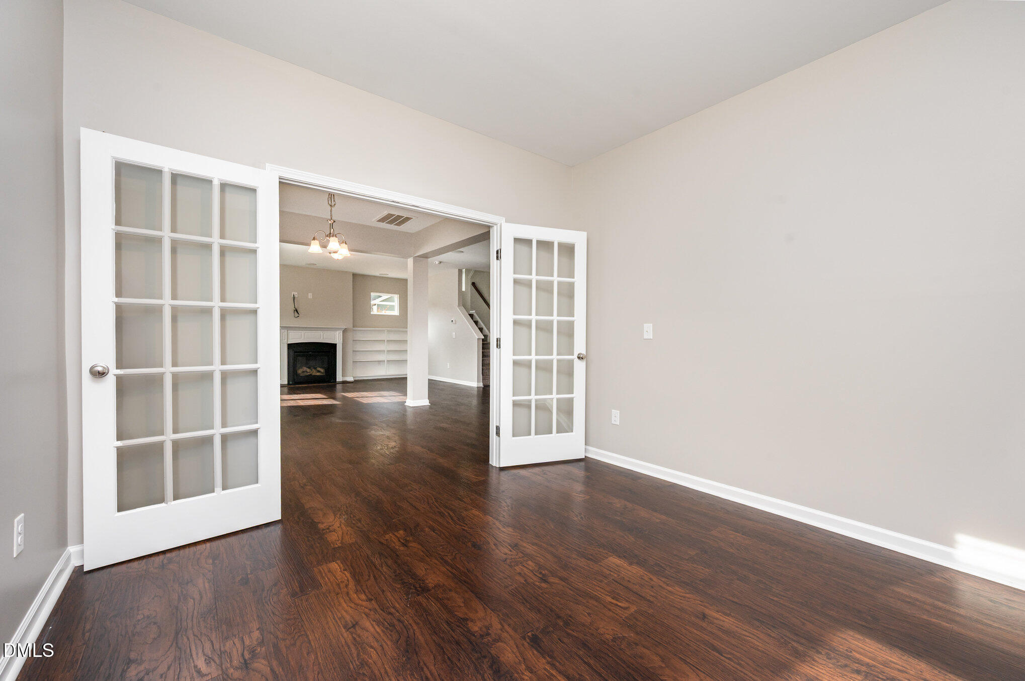 18 Dover Ridge Court Chapel Hill, NC 27517 - Photo 17 of 40 an empty room with wooden floor and windows