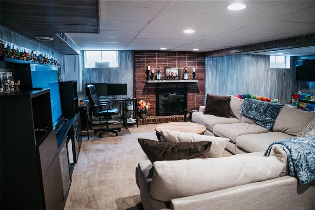 14475 Roberta Drive Irwin, PA 15642 - Photo 14 of 21 a living room with furniture and a flat screen tv