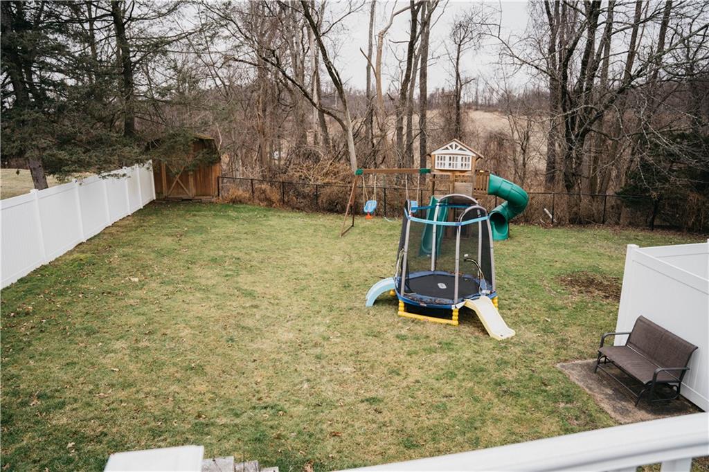 14475 Roberta Drive Irwin, PA 15642 - Photo 19 of 21 a backyard of a house with table and chairs