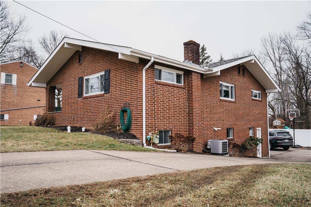 14475 Roberta Drive Irwin, PA 15642 - Photo 20 of 21 a front view of a house with a yard