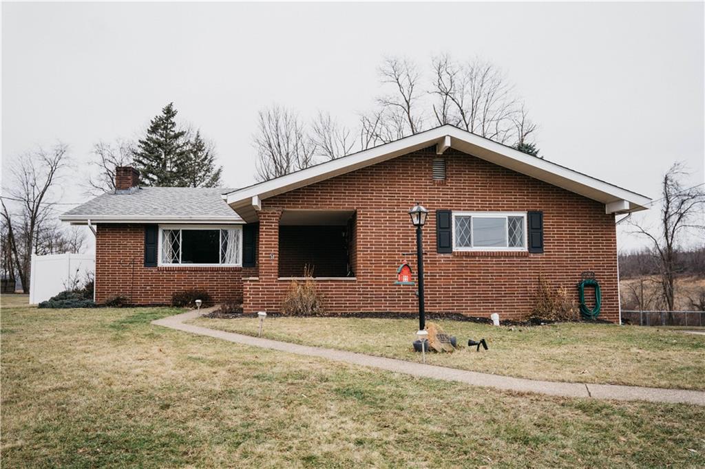14475 Roberta Drive Irwin, PA 15642 - Photo 21 of 21 a front view of a house with yard