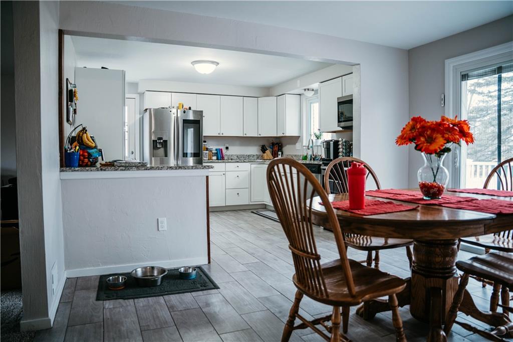 14475 Roberta Drive Irwin, PA 15642 - Photo 5 of 21 a view of a dining room with furniture and chandelier