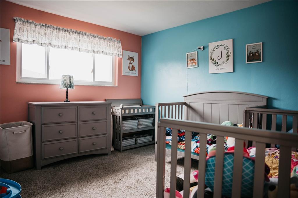 14475 Roberta Drive Irwin, PA 15642 - Photo 10 of 21 a bedroom with furniture a baby crib and a window